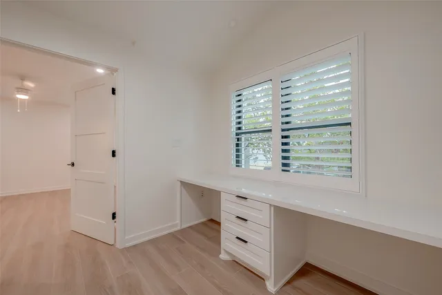 a room with window and cabinet