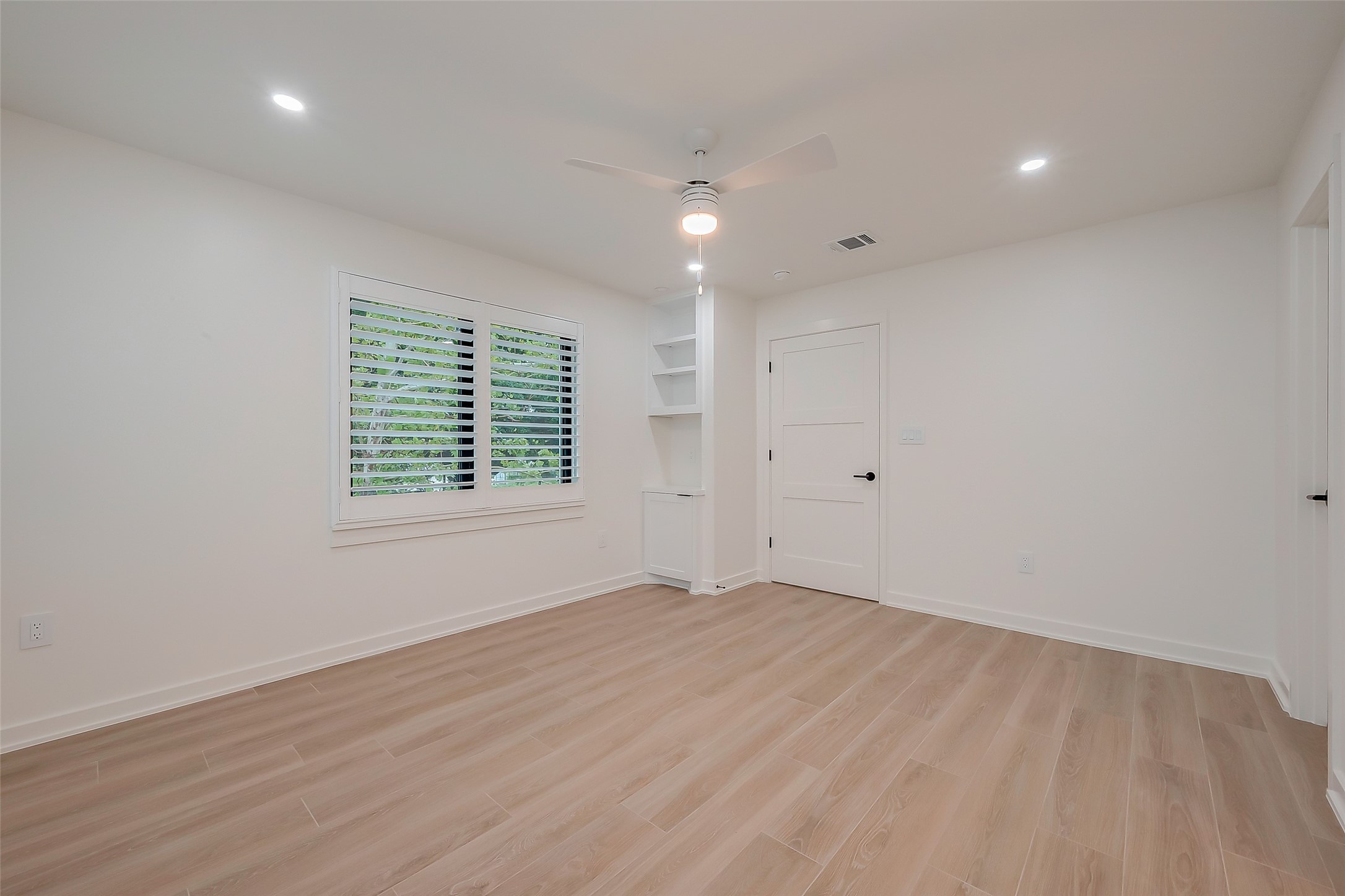 2702 Delano Street Houston, TX 77004 - Photo 28 of 45 wooden floor in an empty room with a window