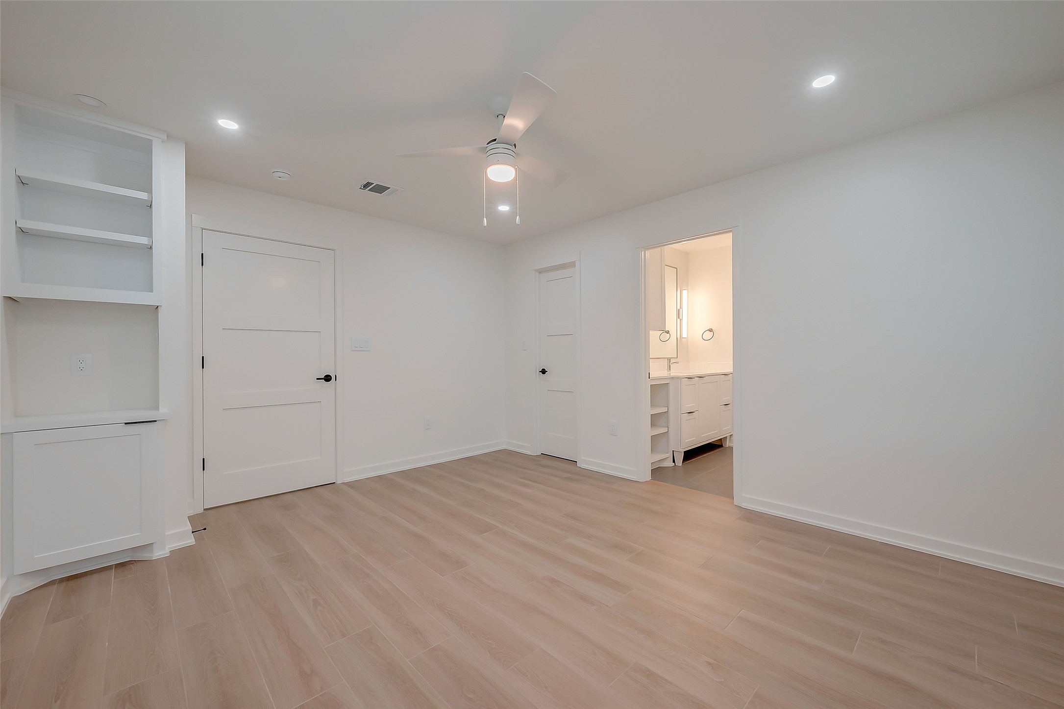 2702 Delano Street Houston, TX 77004 - Photo 29 of 45 wooden floor in an empty room with a window