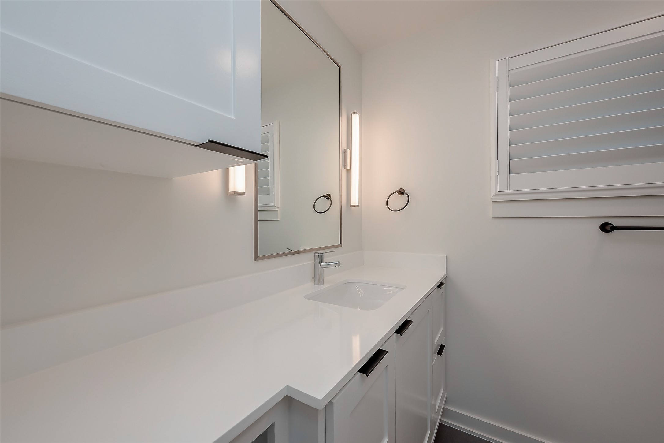 2702 Delano Street Houston, TX 77004 - Photo 30 of 45 a bathroom with a sink a vanity and a mirror