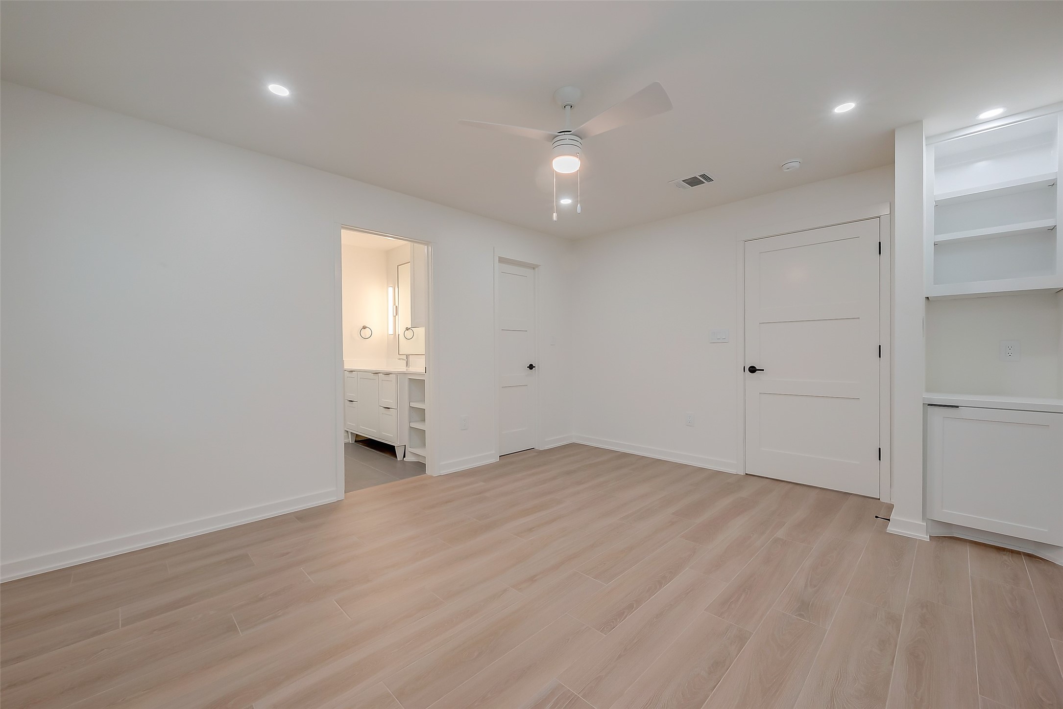 2702 Delano Street Houston, TX 77004 - Photo 34 of 45 an empty room with wooden floor and window