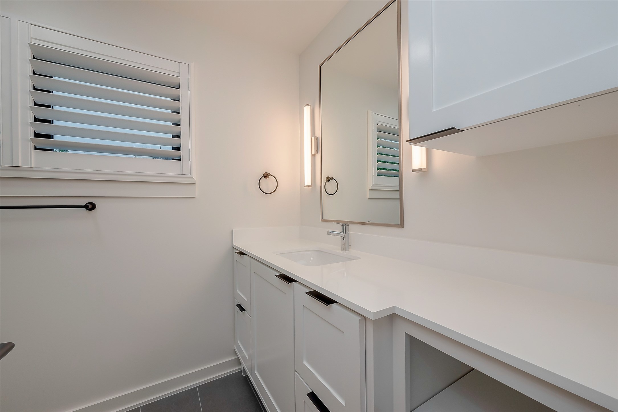 2702 Delano Street Houston, TX 77004 - Photo 35 of 45 a bathroom with a sink and a mirror