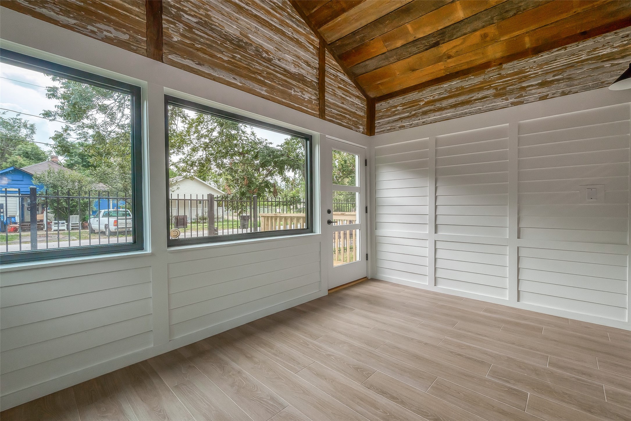 2702 Delano Street Houston, TX 77004 - Photo 44 of 45 a view of an empty room with wooden floor and a window