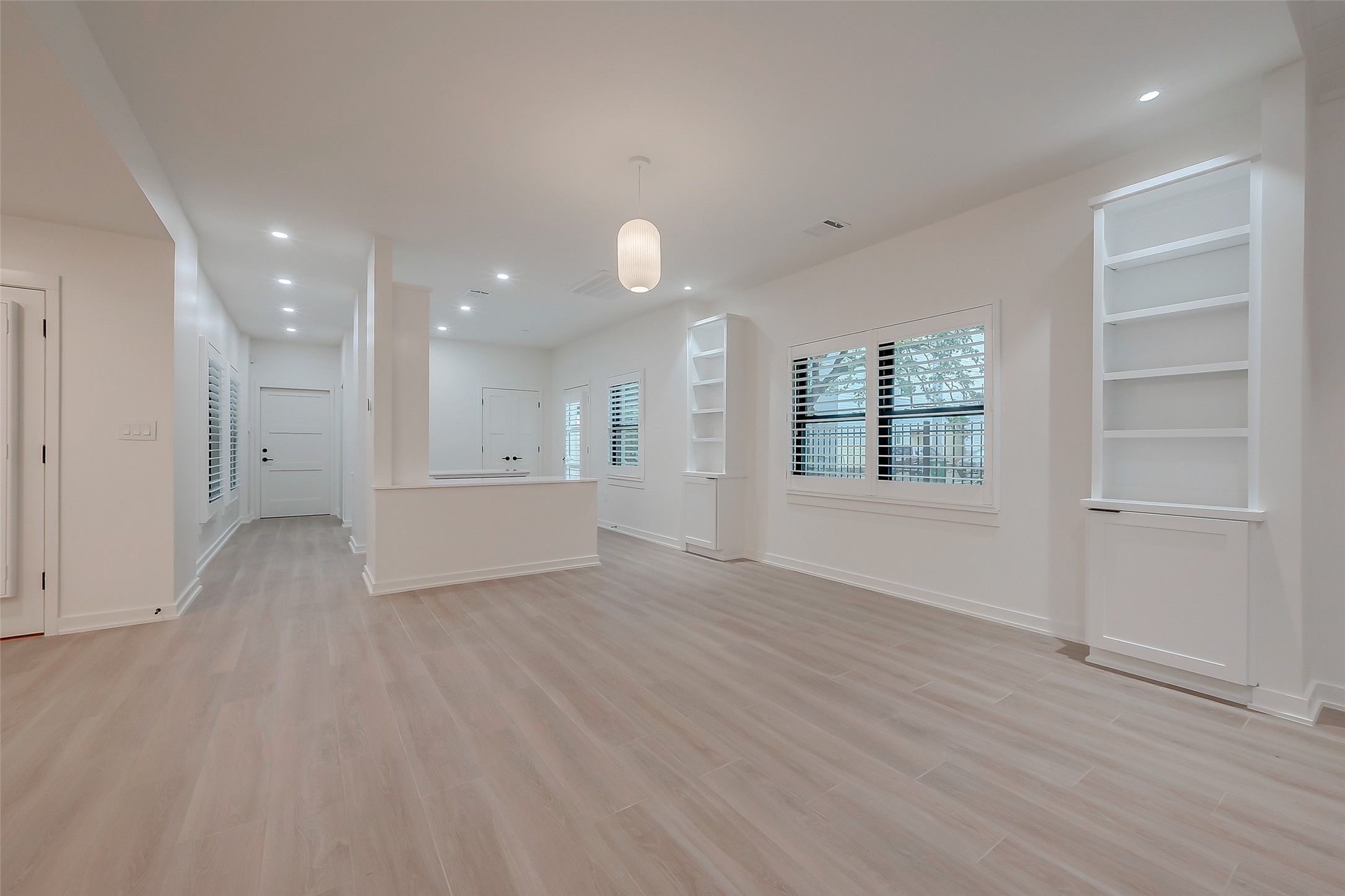 2702 Delano Street Houston, TX 77004 - Photo 9 of 45 an empty room with wooden floor and windows