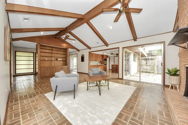 a balcony with furniture and wooden floor