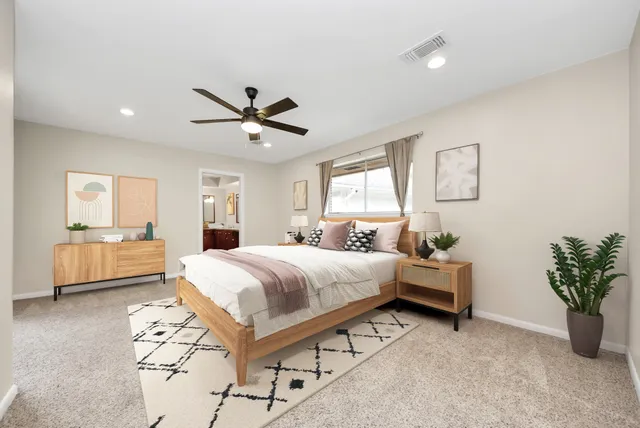 a bedroom with a bed and a couch