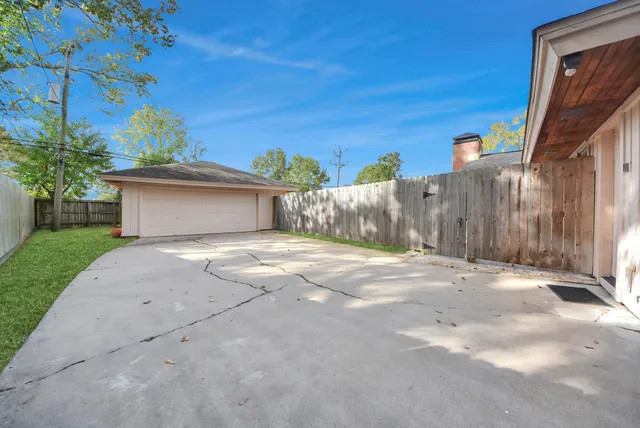 a view of a house with a yard and garage