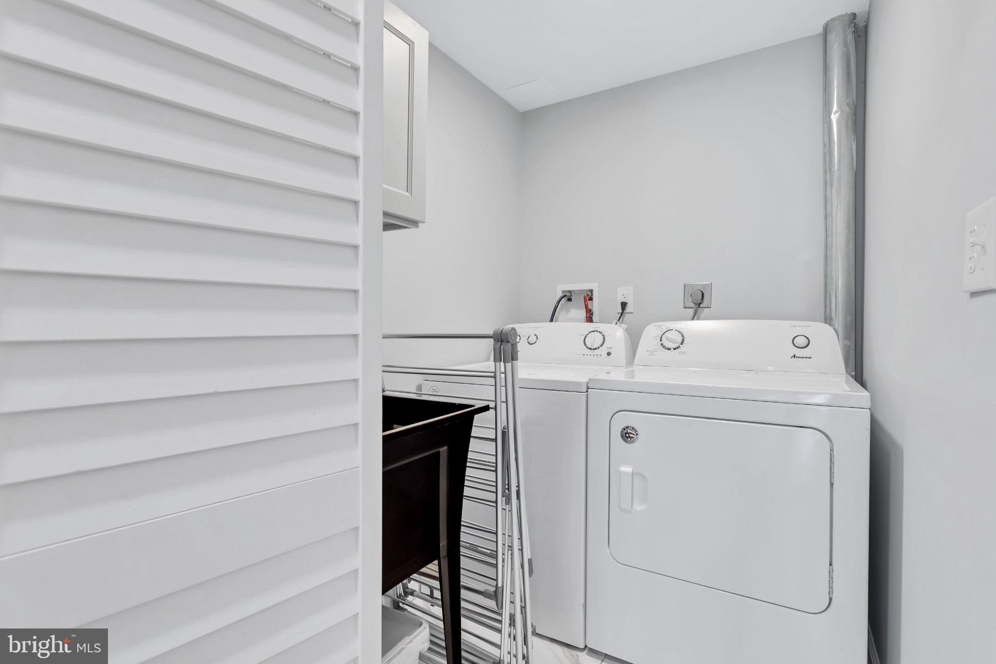 9009 Sweet Birch Court Springfield, VA 22152 - Photo 25 of 34 Modern laundry space with sleek design.