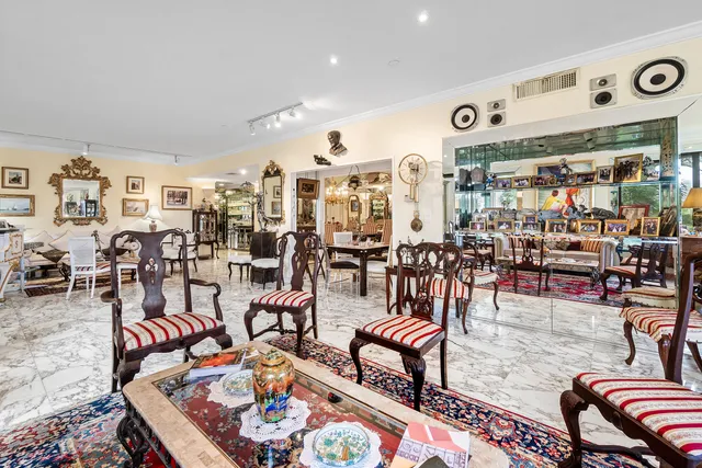 a living room with lots of furniture and white walls
