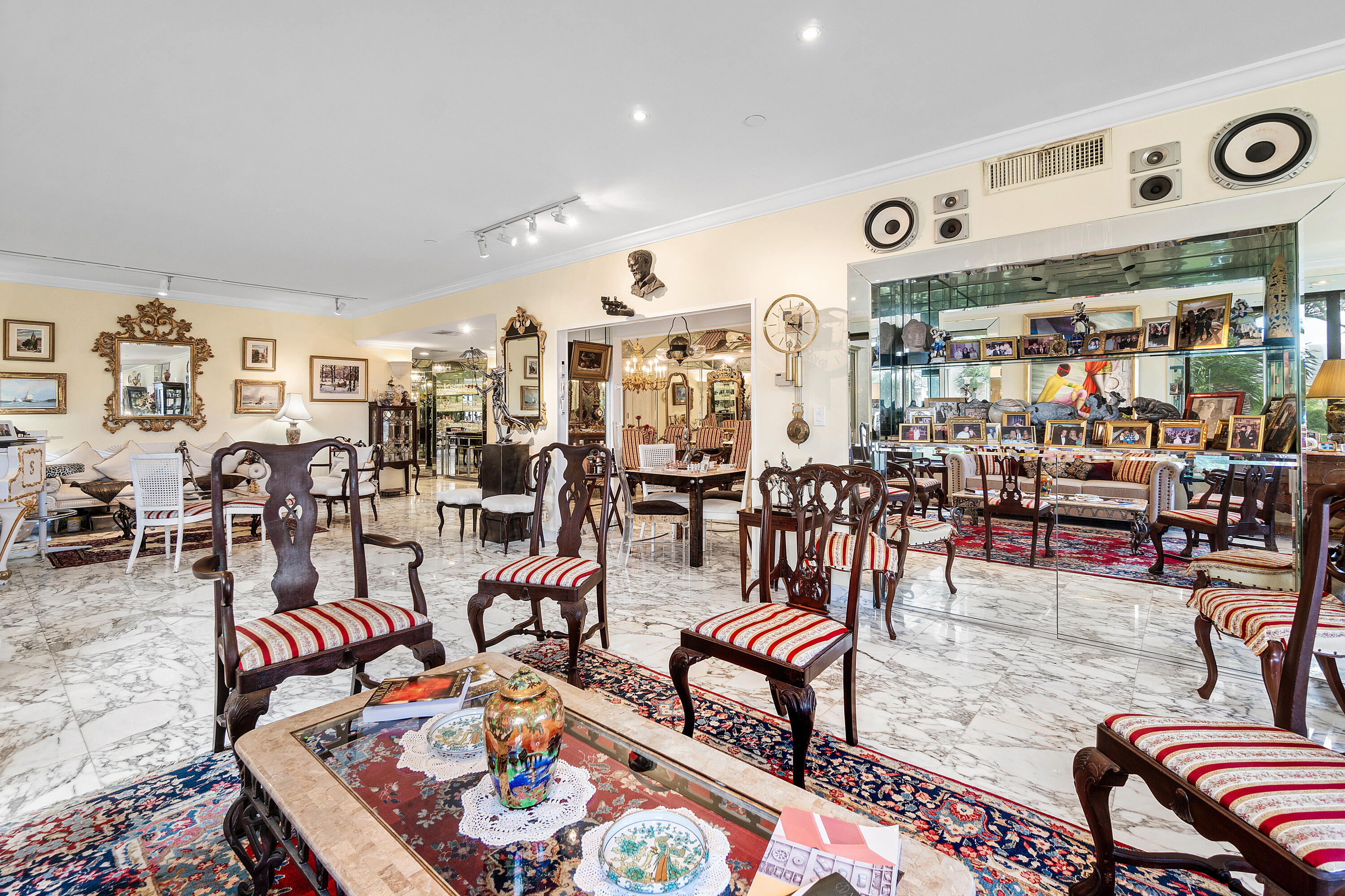 150 Bradley Place, Unit 101 Palm Beach, FL 33480 - Photo 11 of 38 a living room with lots of furniture and white walls