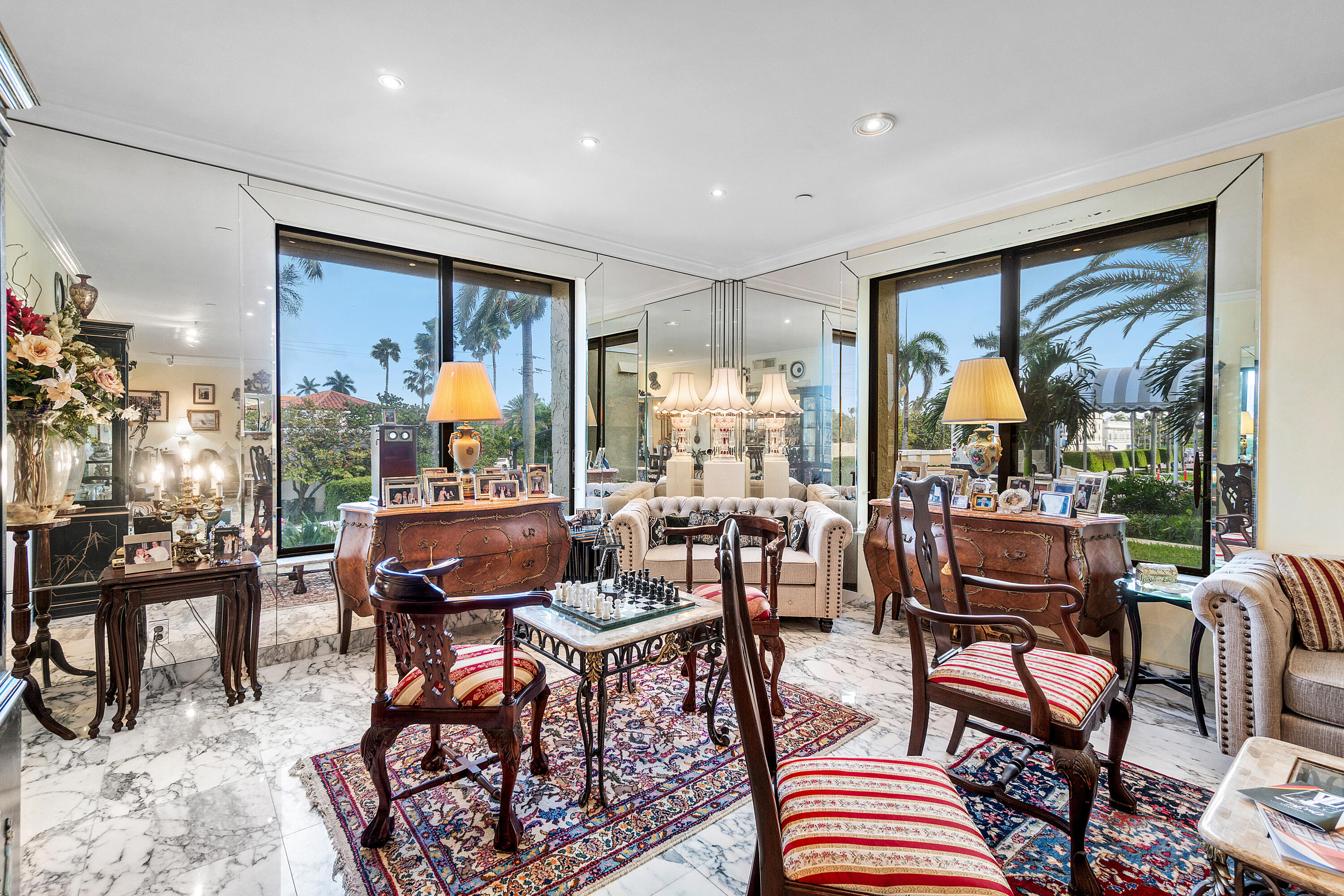 150 Bradley Place, Unit 101 Palm Beach, FL 33480 - Photo 21 of 38 a living room with furniture and a large window
