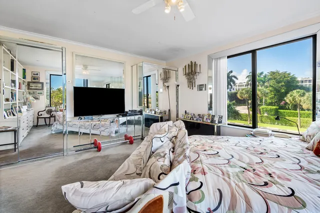 a kitchen with sink refrigerator and large window