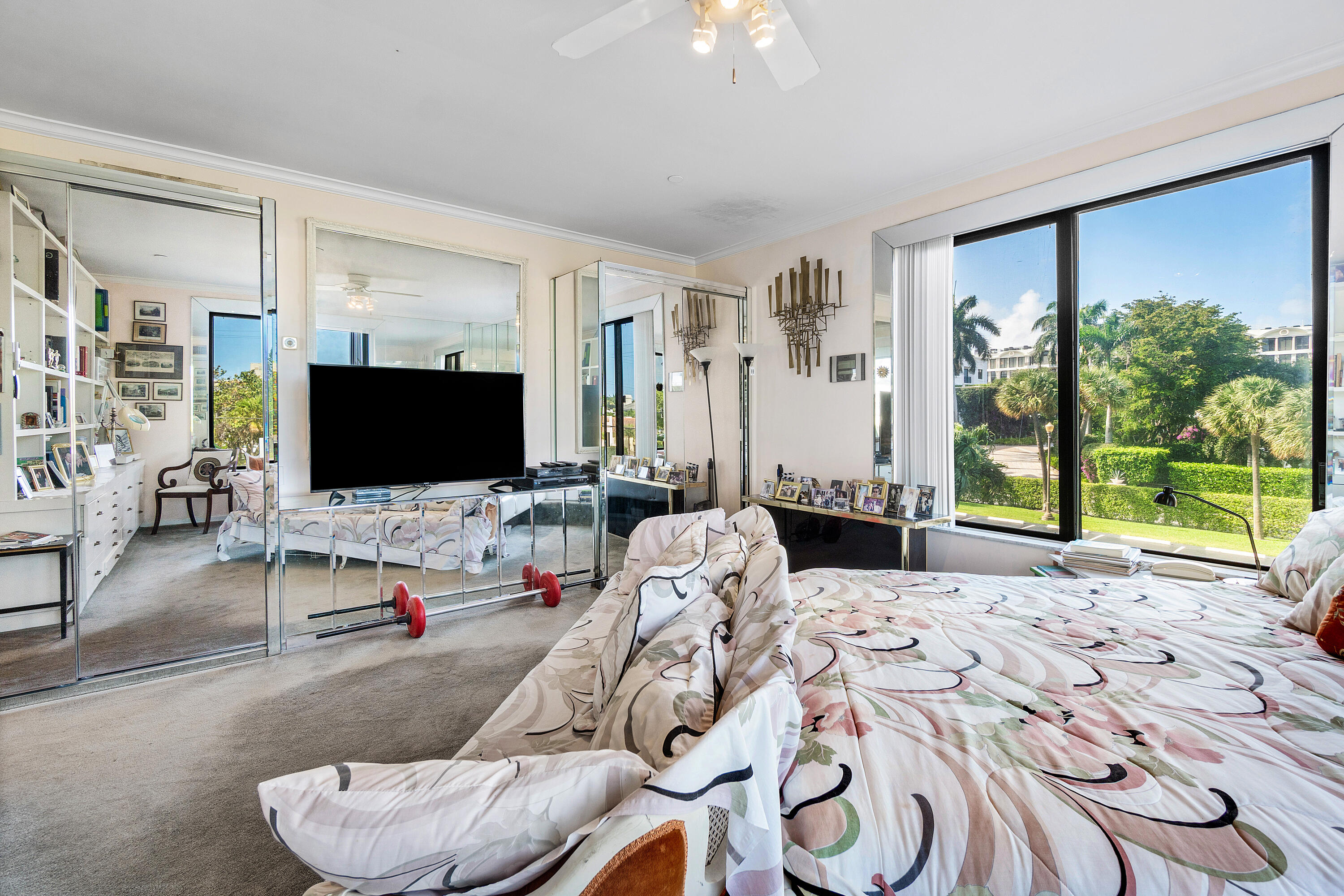 150 Bradley Place, Unit 101 Palm Beach, FL 33480 - Photo 25 of 38 a living room with furniture and a flat screen tv