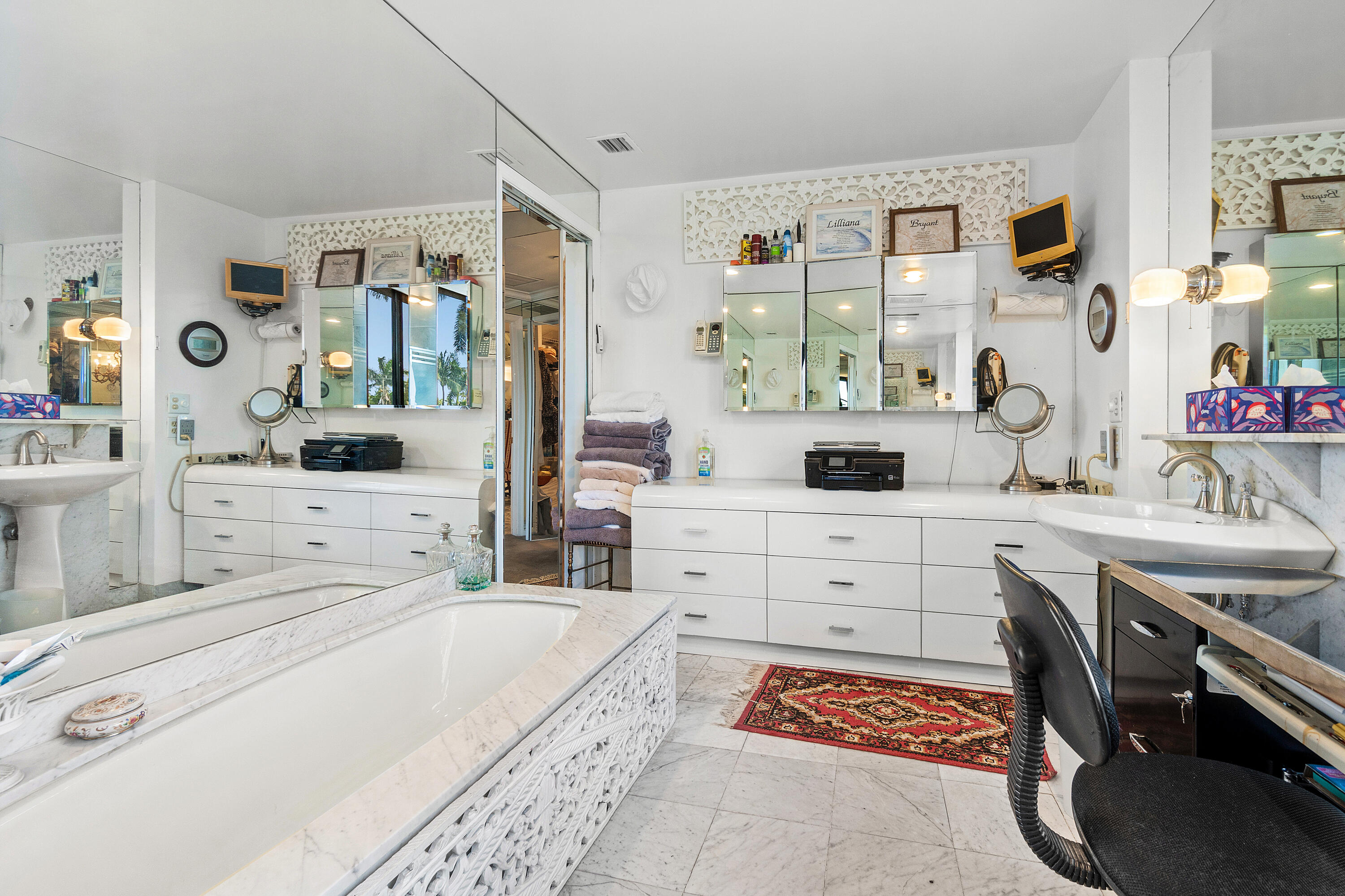 150 Bradley Place, Unit 101 Palm Beach, FL 33480 - Photo 28 of 38 a bedroom with a bed and a dresser