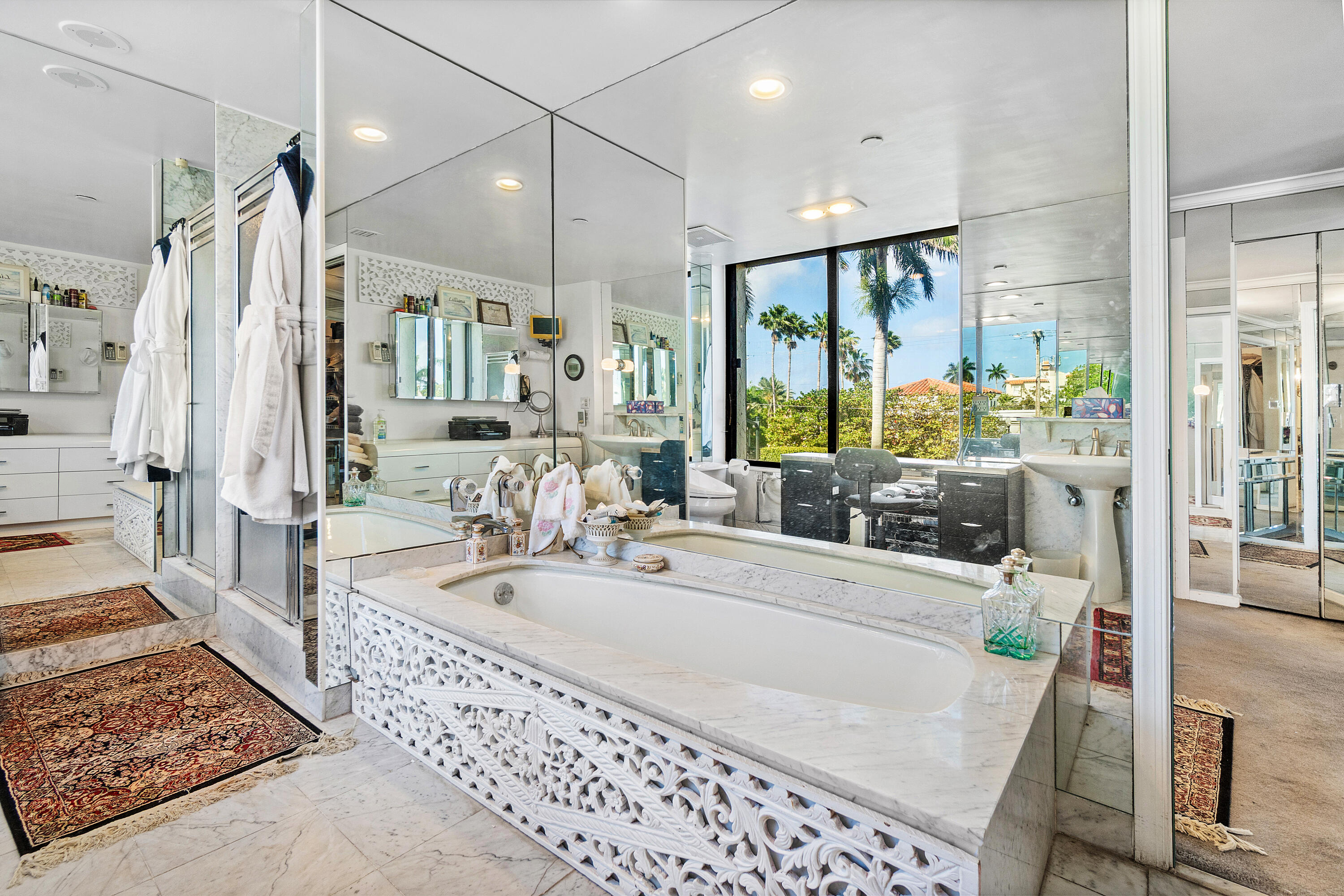 150 Bradley Place, Unit 101 Palm Beach, FL 33480 - Photo 29 of 38 a large bathroom with a tub a sink a mirror and a shower