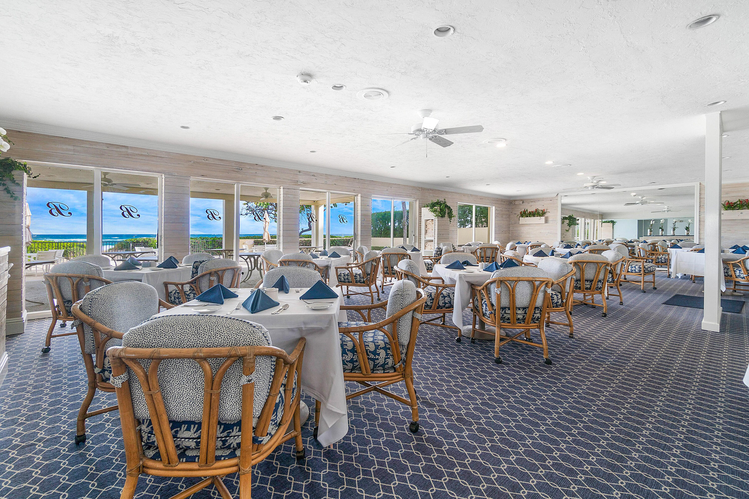 150 Bradley Place, Unit 101 Palm Beach, FL 33480 - Photo 32 of 38 a living room with lots of furniture and a rug