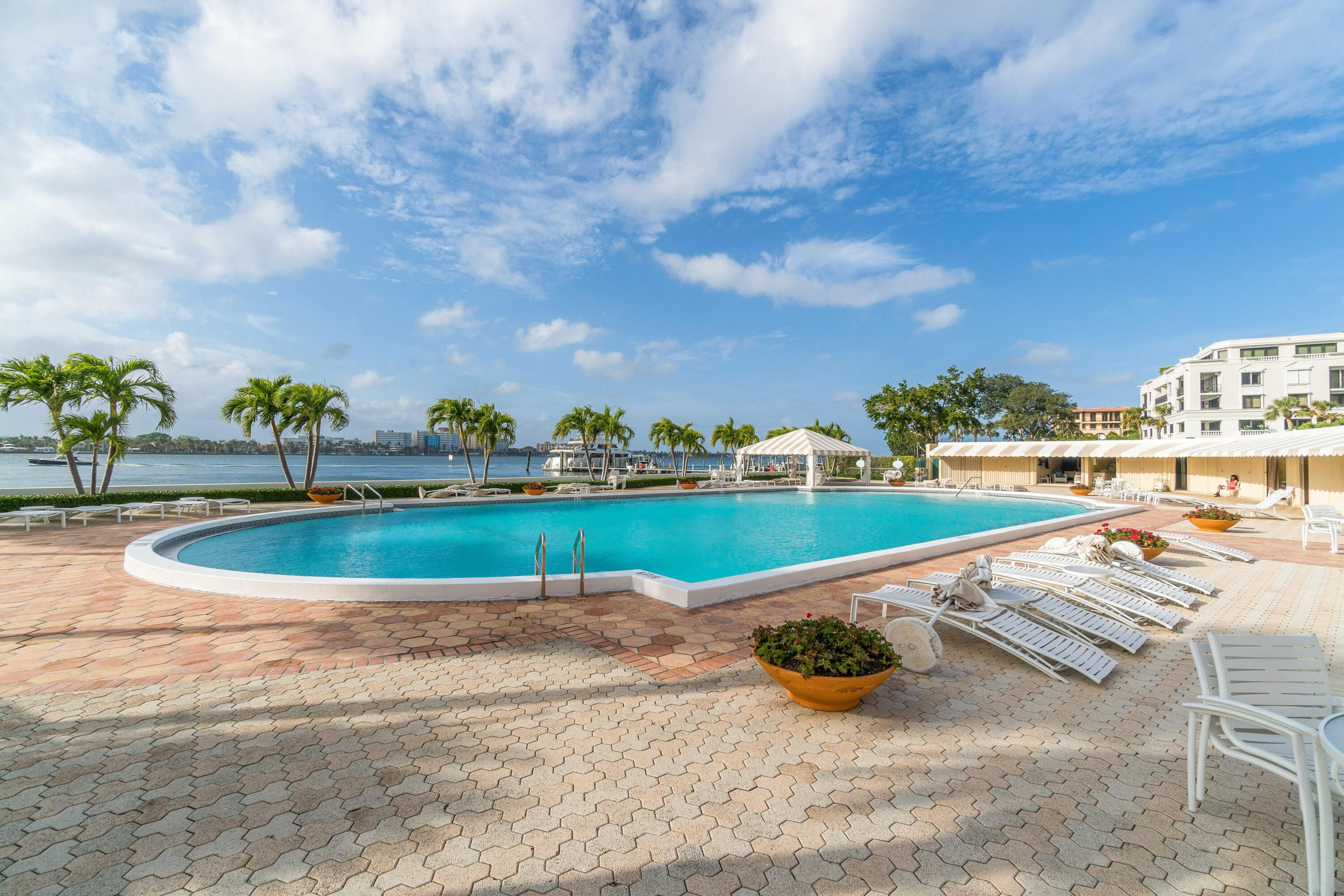 150 Bradley Place, Unit 101 Palm Beach, FL 33480 - Photo 35 of 38 a view of a swimming pool with a yard