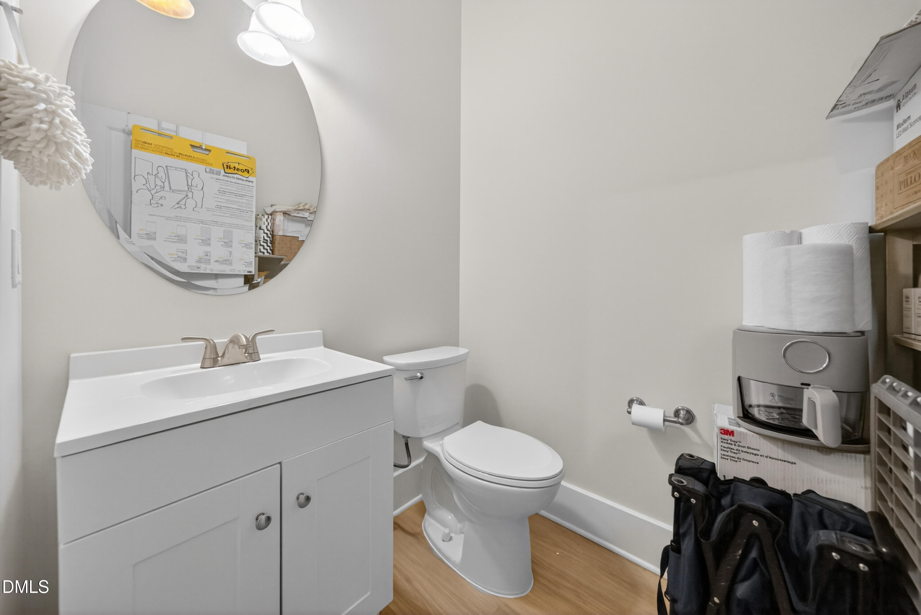 444 South Blount Street, Unit 111 Raleigh, NC 27601 - Photo 27 of 40 a bathroom with a toilet sink and mirror