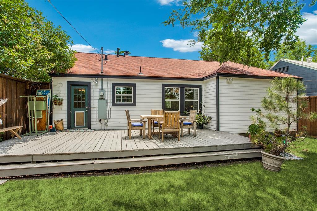 8619 Angora Street Dallas, TX 75218 - Photo 21 of 24 Rear view of property with a wooden deck and a lawn
