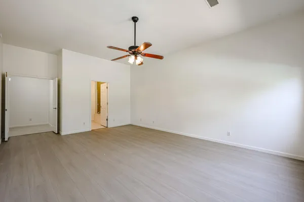 a view of an empty room with a chandelier