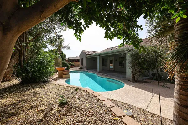a view of a house with a small yard