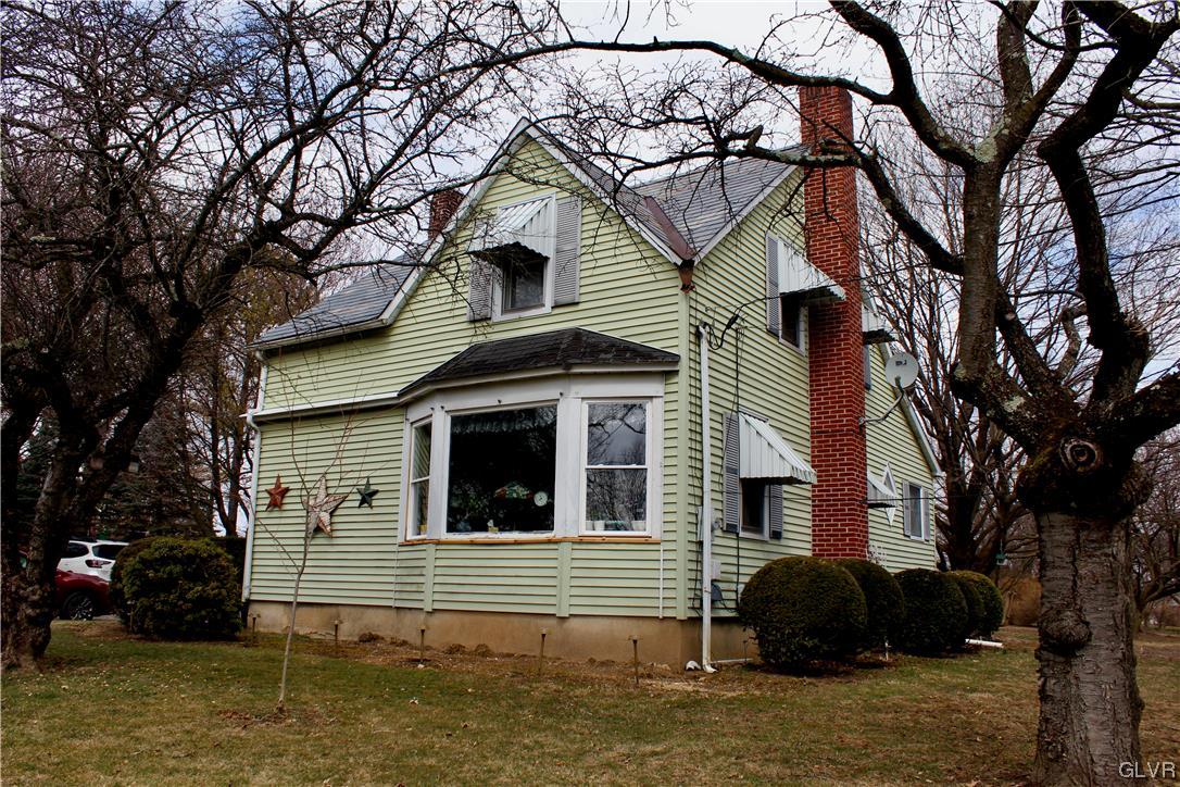 560 Cherry Hill Road Nazareth, PA 18064 - Photo 2 of 48 a front view of a house with a garden