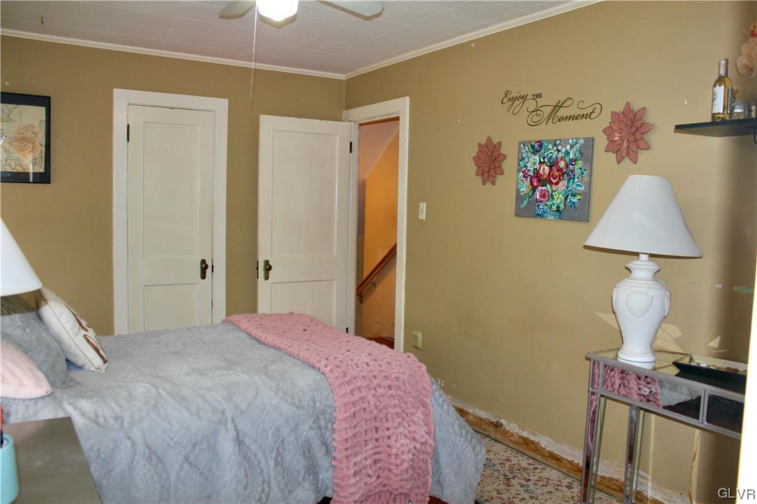 560 Cherry Hill Road Nazareth, PA 18064 - Photo 24 of 48 a bedroom with a bed and a lamp on table