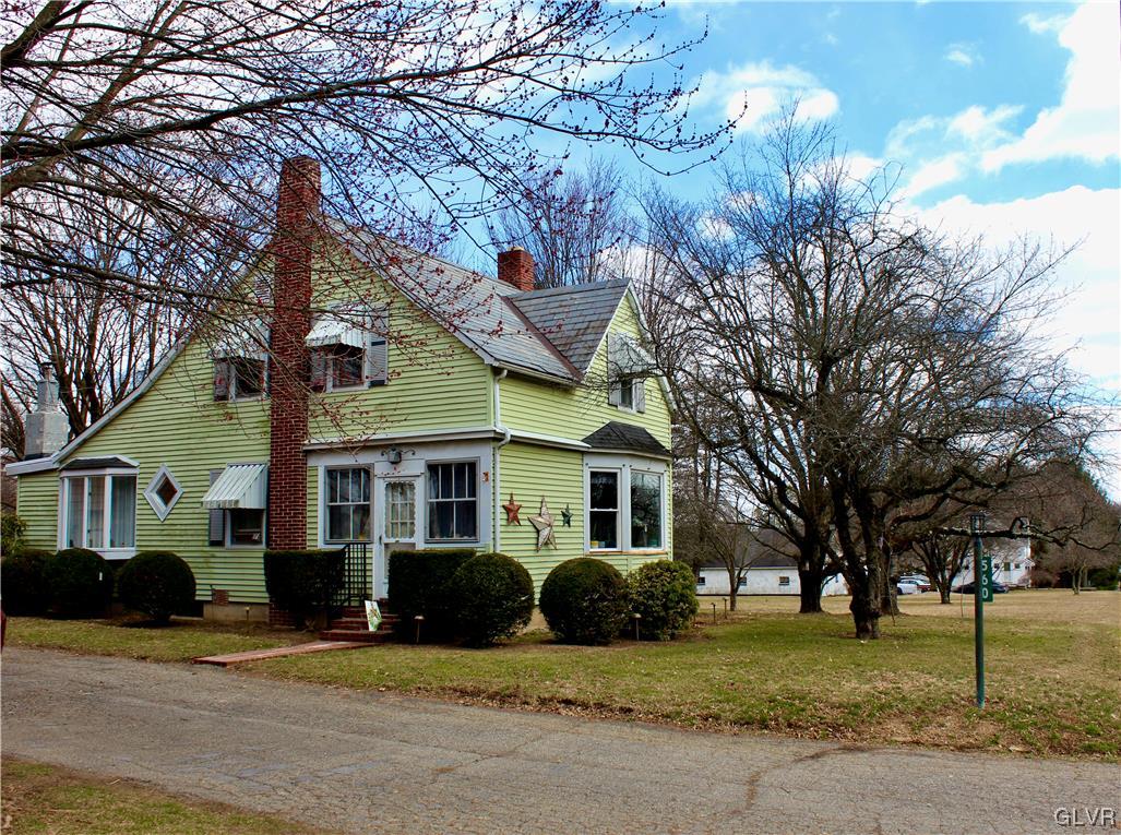 560 Cherry Hill Road Nazareth, PA 18064 - Photo 3 of 48 a view of a white house with a large tree and wooden fence