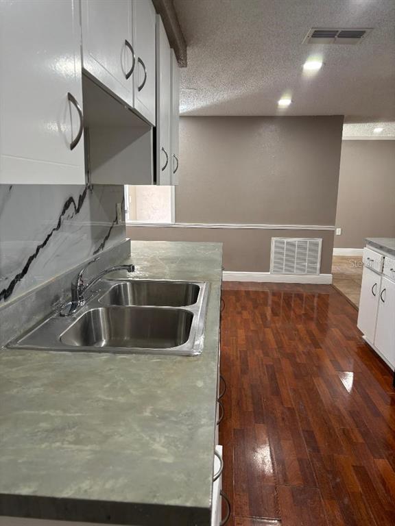 15827 Adobe Drive Hudson, FL 34667 - Photo 4 of 12 a kitchen with a sink and cabinets