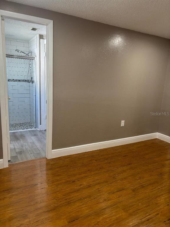 15827 Adobe Drive Hudson, FL 34667 - Photo 7 of 12 a view of an empty room with wooden floor and closet