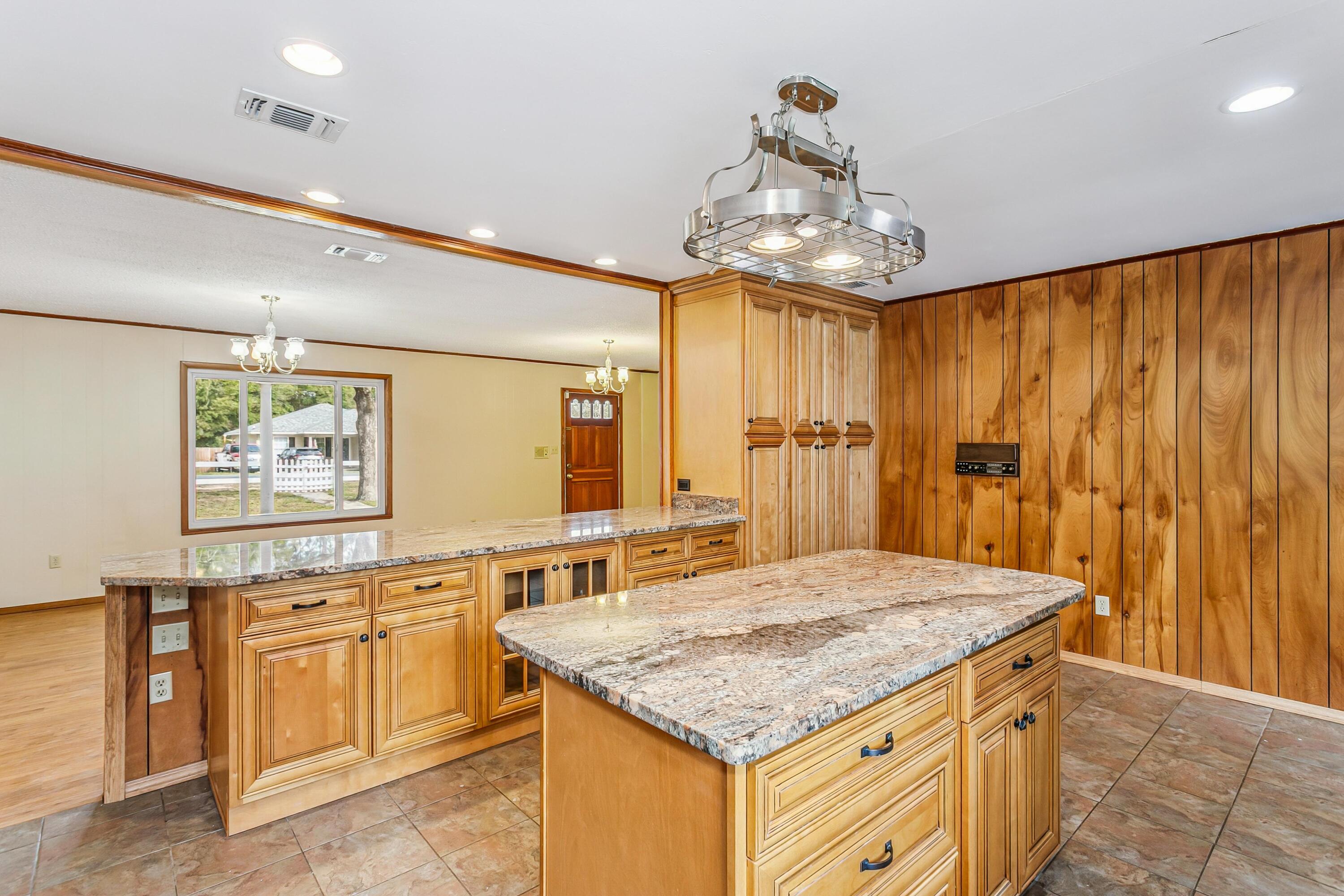 3146 Forrest Avenue Crestview, FL 32539 - Photo 14 of 47 a kitchen with stainless steel appliances granite countertop a sink stove and refrigerator