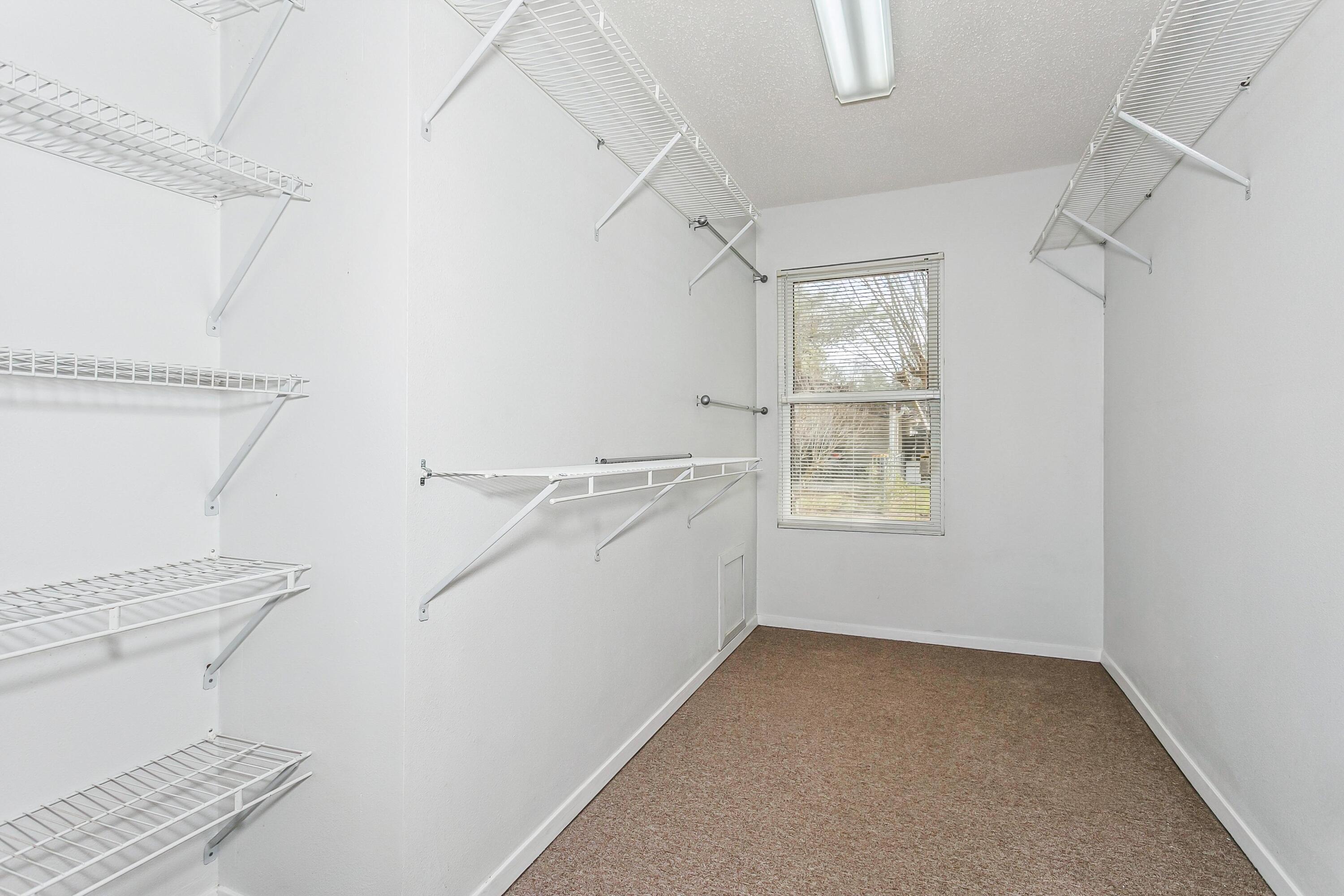 3146 Forrest Avenue Crestview, FL 32539 - Photo 18 of 47 a bathroom with a sink a toilet and a window