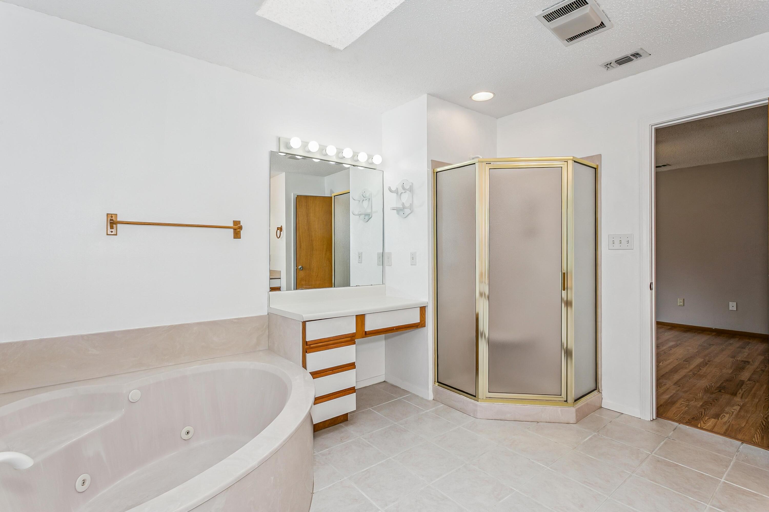 3146 Forrest Avenue Crestview, FL 32539 - Photo 19 of 47 a bathroom with a bathtub and a shower