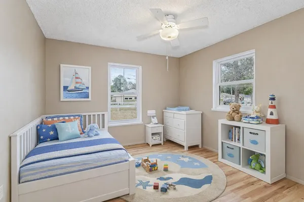 a bedroom with furniture and a window