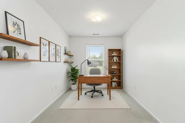 a view of a livingroom with furniture and wooden floor