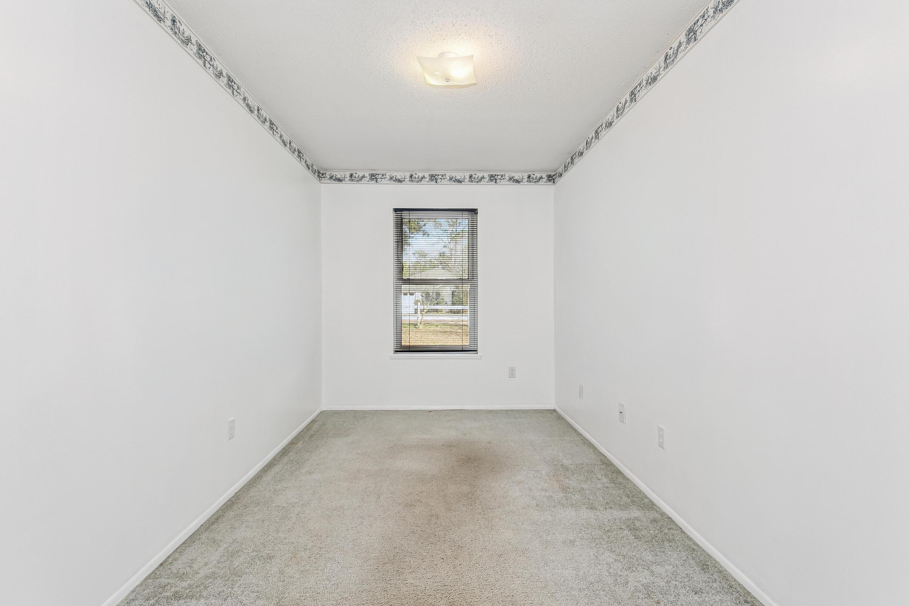 3146 Forrest Avenue Crestview, FL 32539 - Photo 34 of 47 an empty room with windows