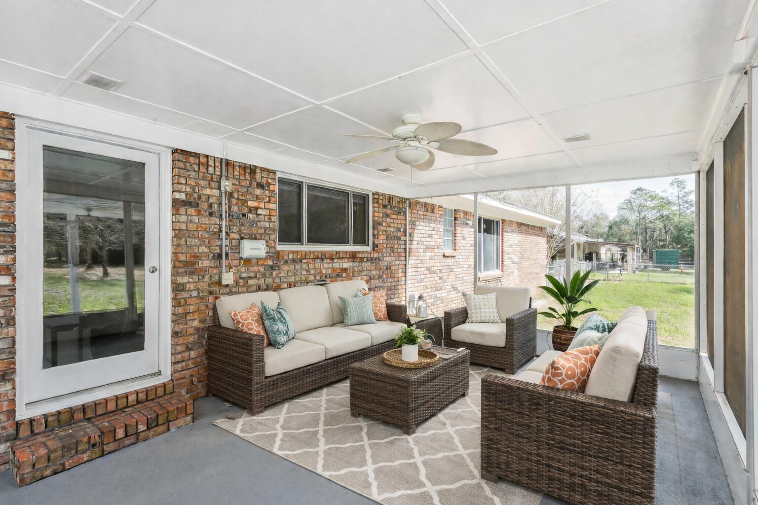 3146 Forrest Avenue Crestview, FL 32539 - Photo 37 of 47 a living room with furniture and a flat screen tv