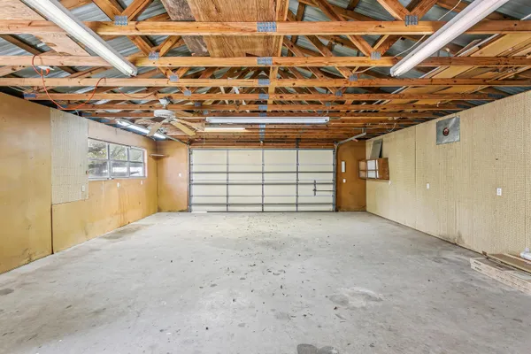 a view of a room with wooden walls