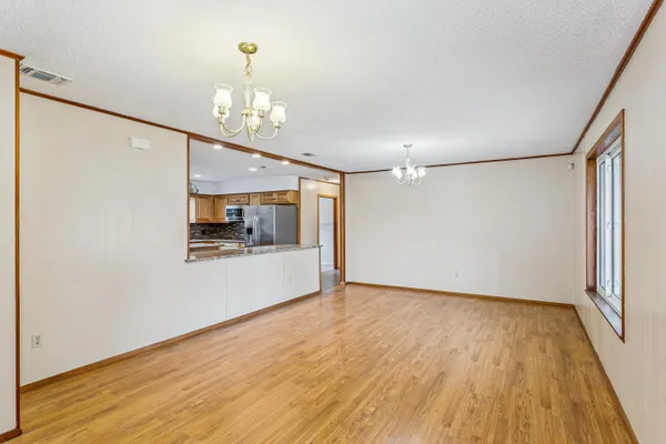 a view of livingroom with hardwood floor and a ceiling fan