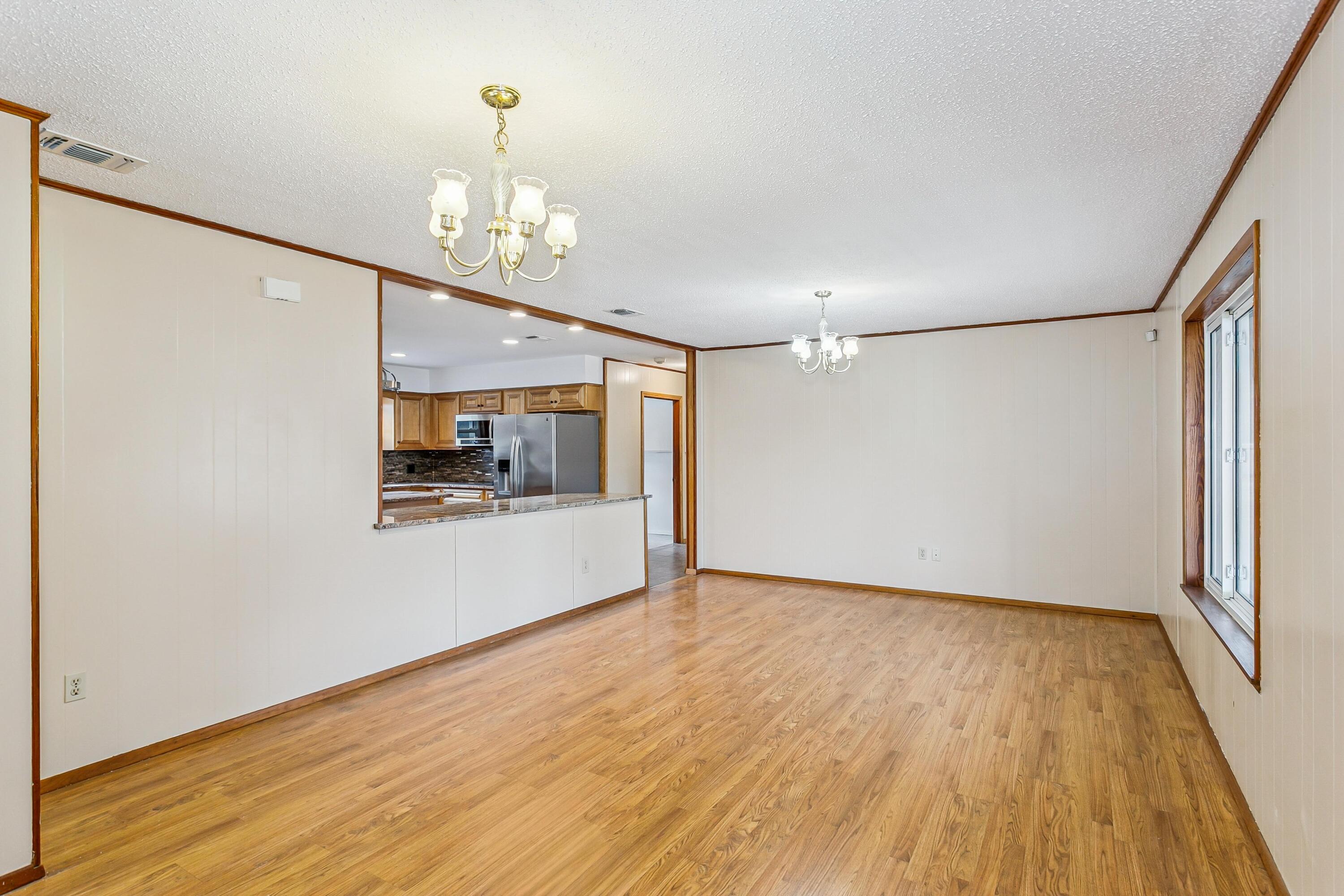 3146 Forrest Avenue Crestview, FL 32539 - Photo 10 of 47 a view of livingroom with hardwood floor and a ceiling fan