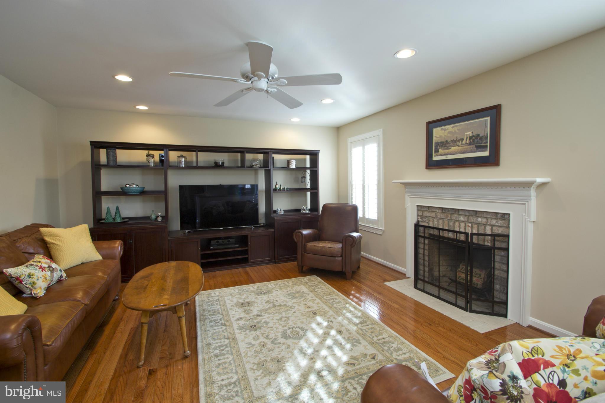 1518 Fenway Road Crofton, MD 21114 - Photo 13 of 30 Family Room with fireplace & hardwood flooring