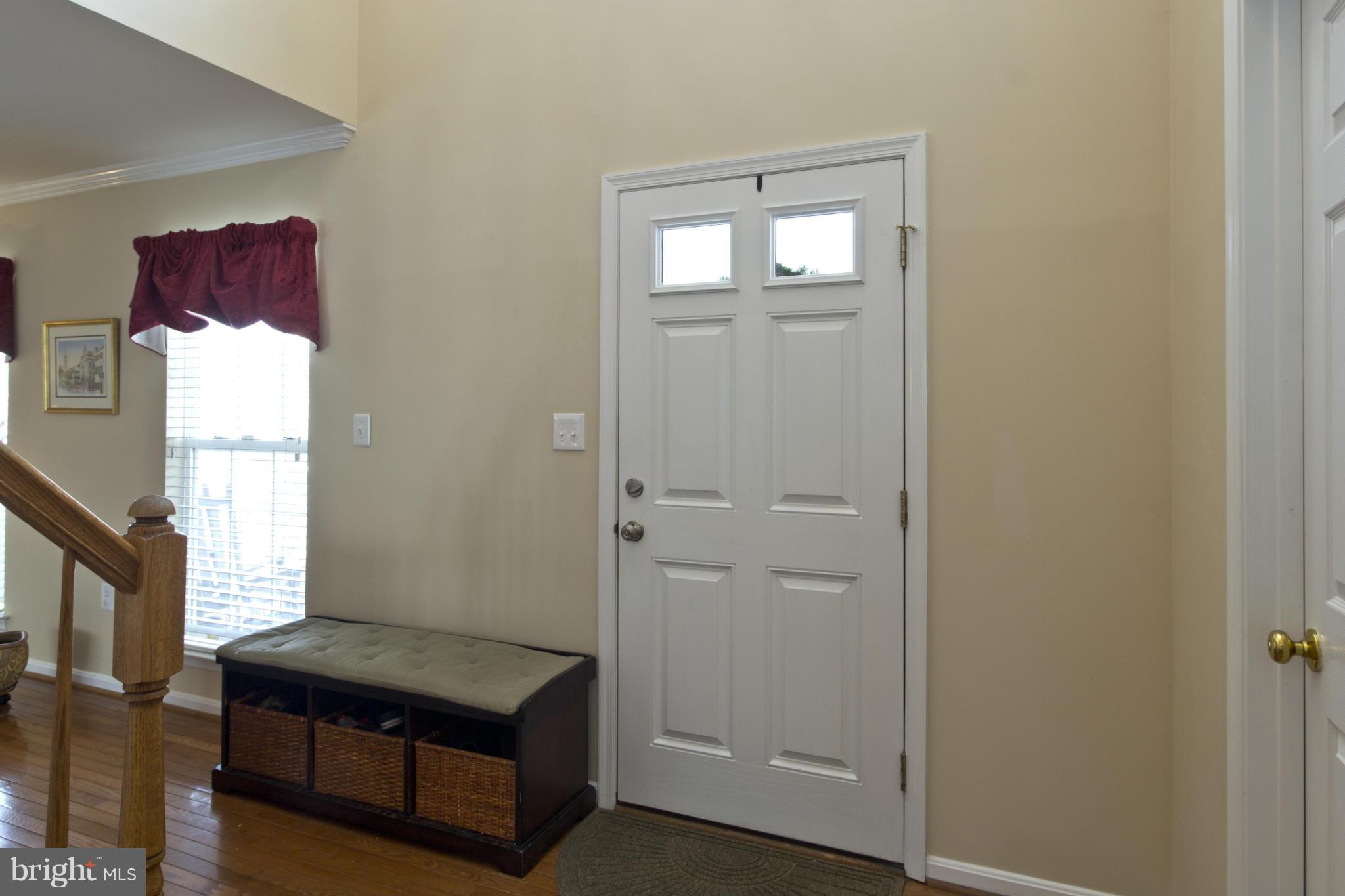 1518 Fenway Road Crofton, MD 21114 - Photo 3 of 30 Two story foyer with hardwood flooring