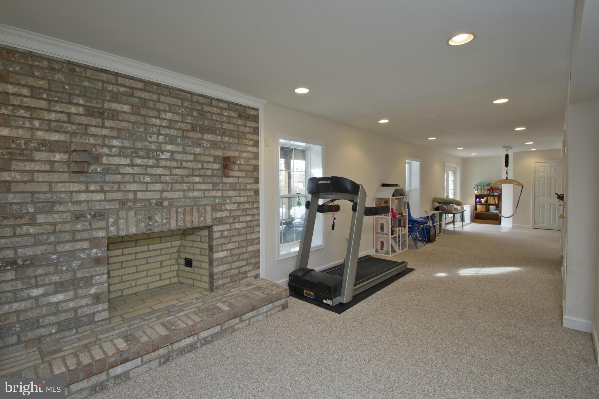 1518 Fenway Road Crofton, MD 21114 - Photo 23 of 30 Walk out lower level with fireplace