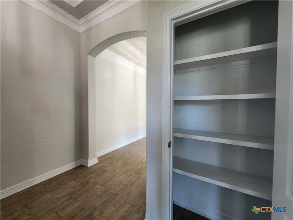 a view of an empty walk in closet