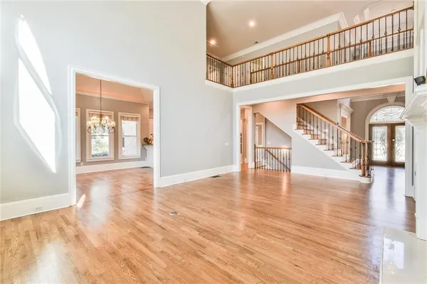 a view of entryway and hall with wooden floor
