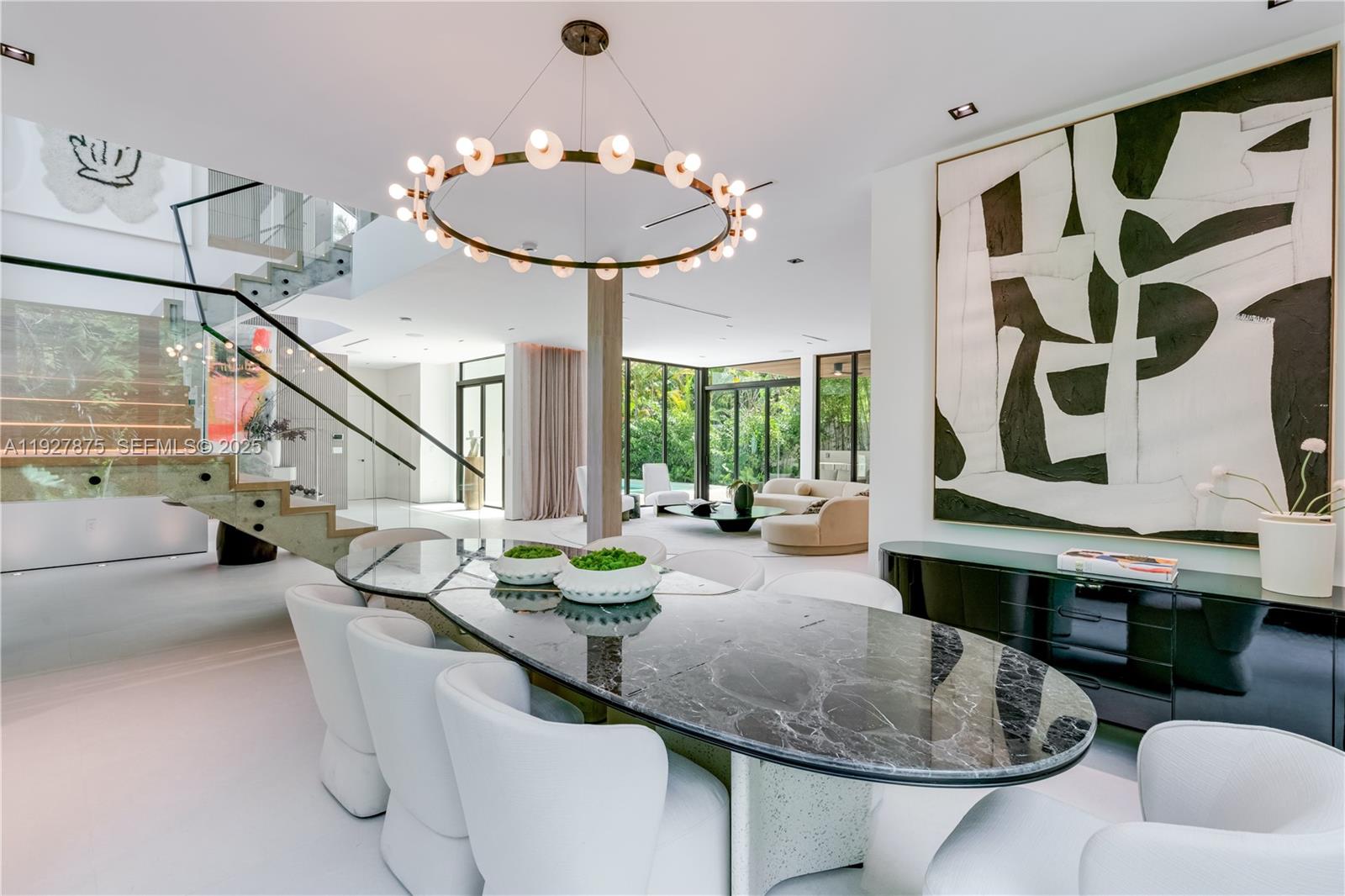 2800 Calusa Street Miami, FL 33133 - Photo 11 of 71 a living room with furniture and chandelier