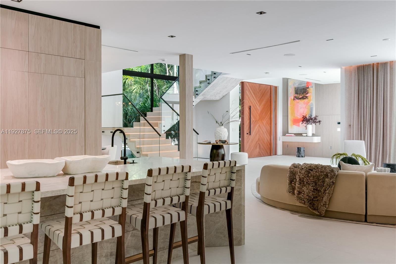 2800 Calusa Street Miami, FL 33133 - Photo 18 of 71 a living room with furniture a large window and a chandelier