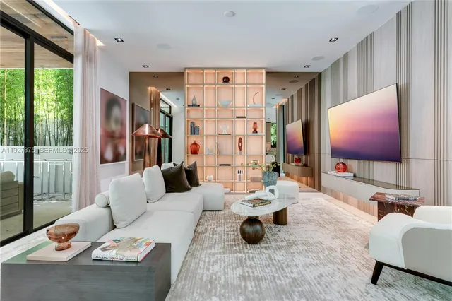 a view of living room with furniture and a large window