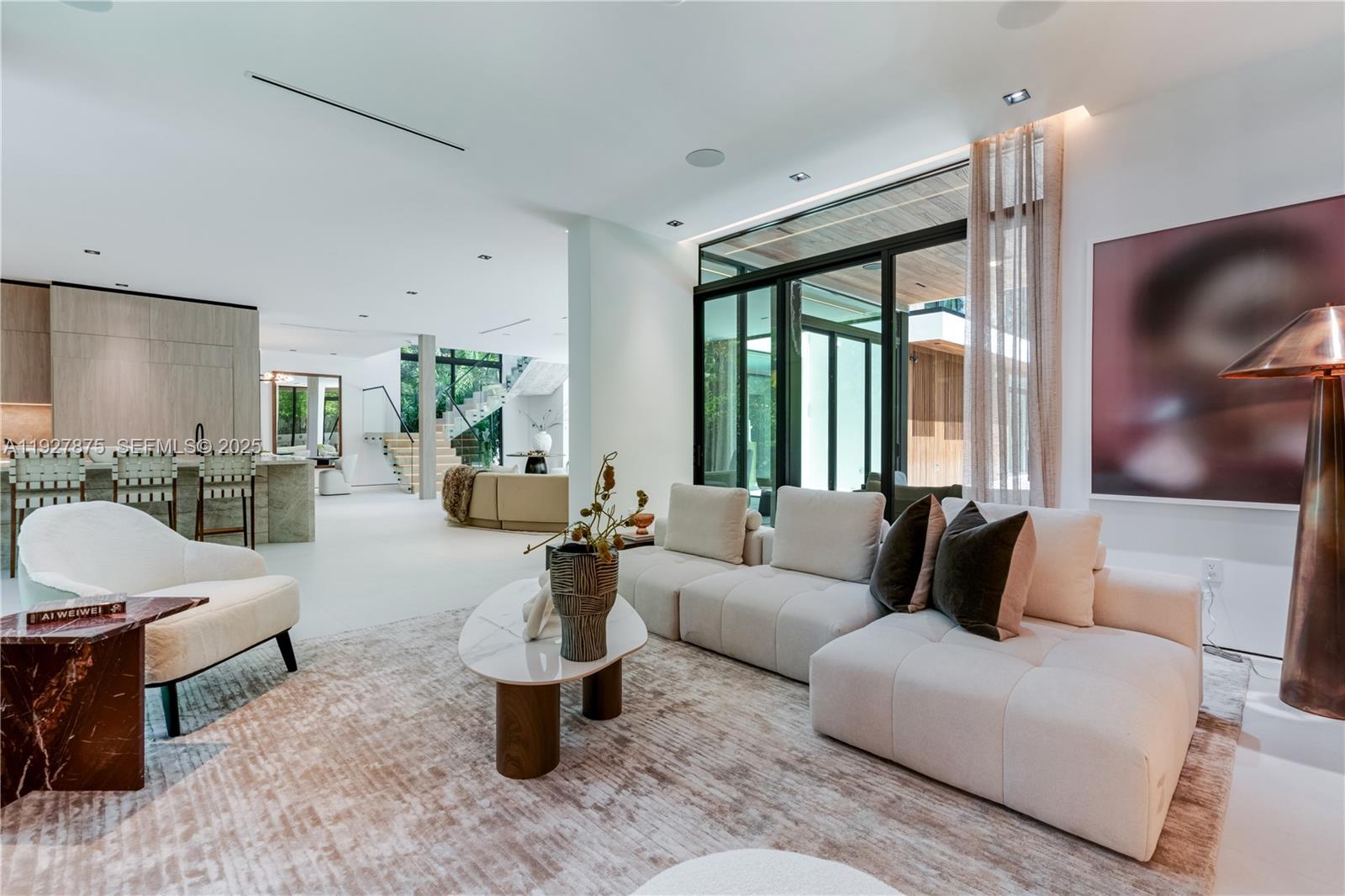 2800 Calusa Street Miami, FL 33133 - Photo 21 of 71 a living room with furniture and a flat screen tv