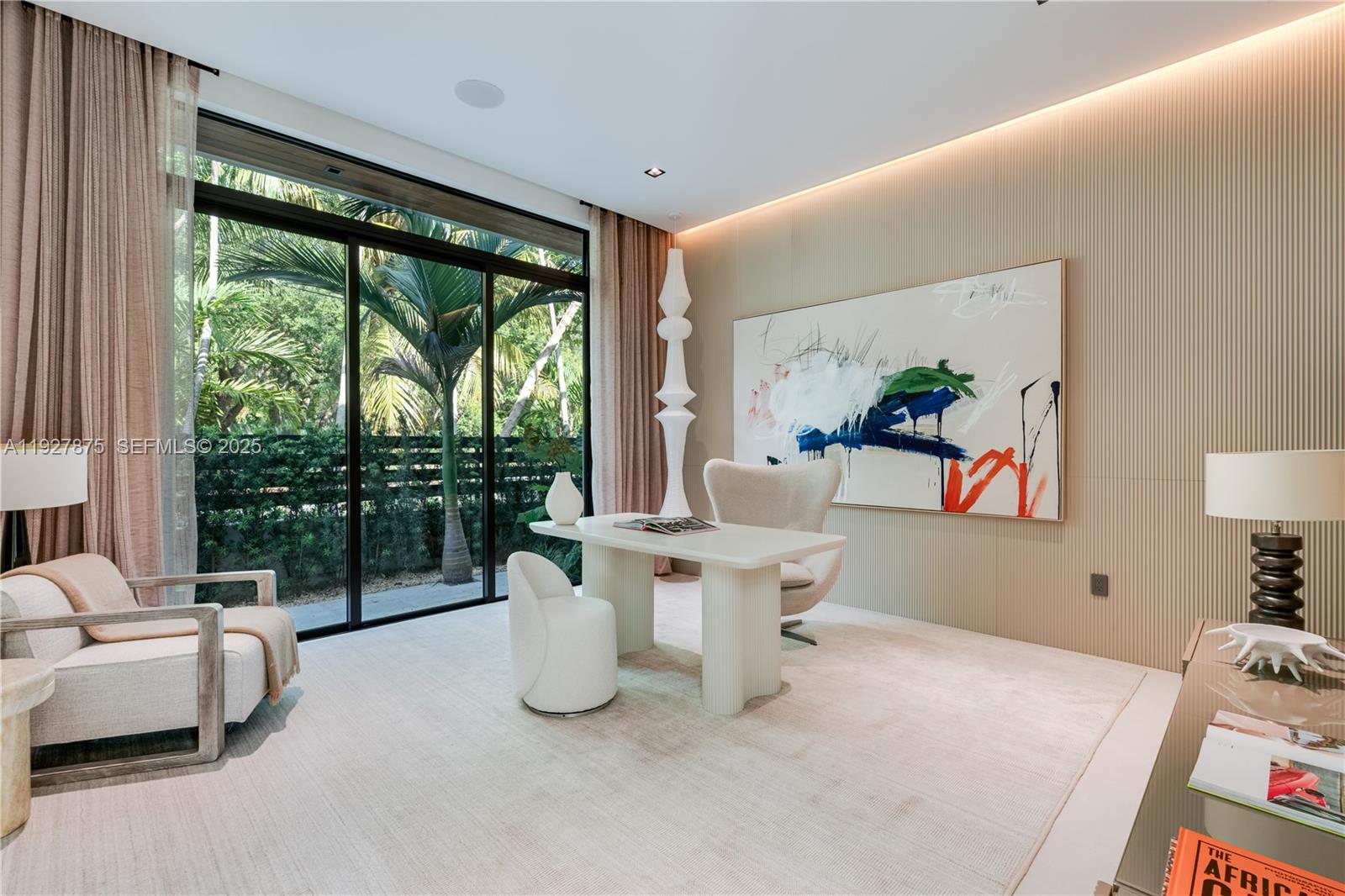 2800 Calusa Street Miami, FL 33133 - Photo 23 of 71 a living room with furniture and a large window